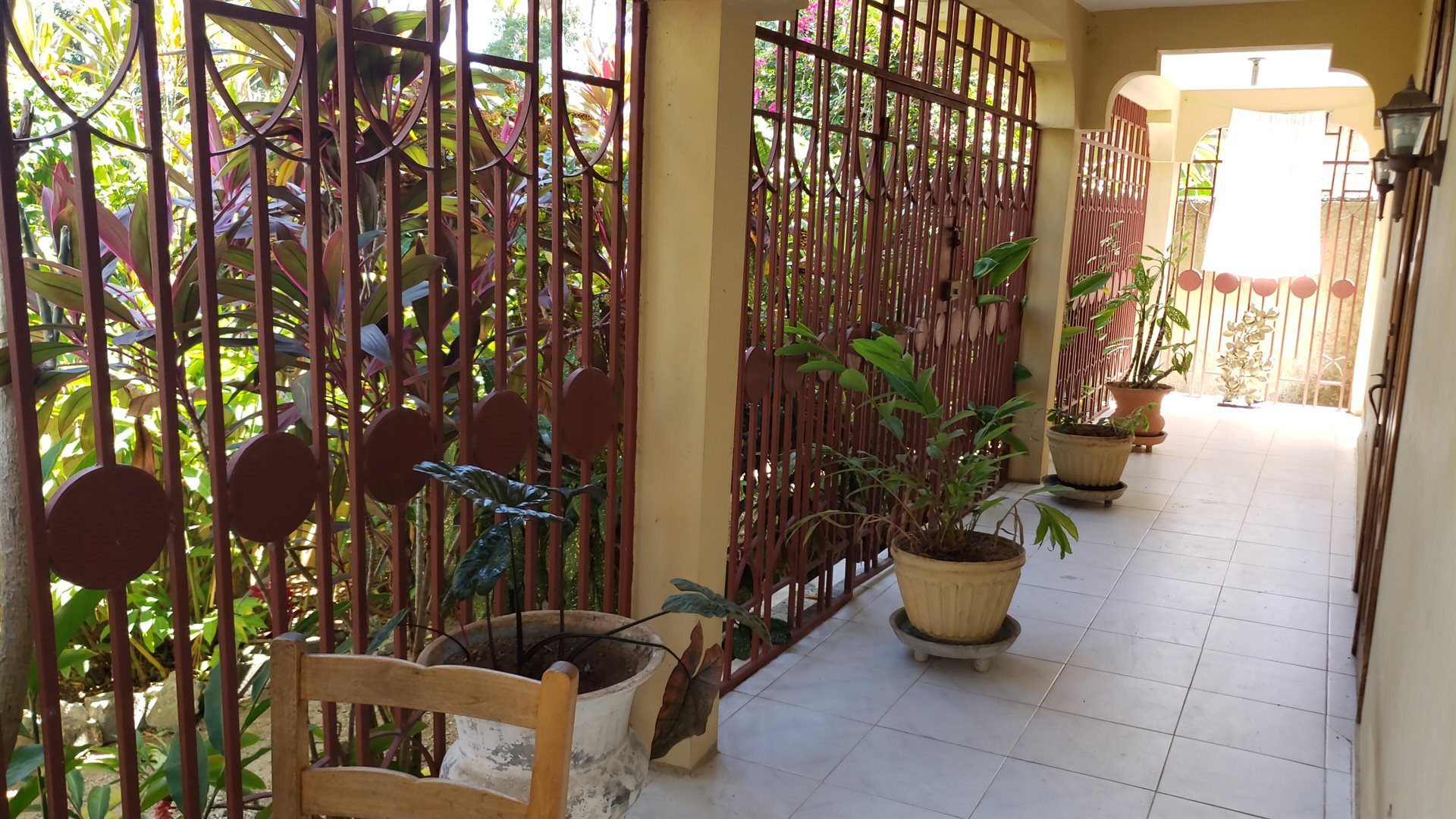 Two-Story House + Apartment + Land for Sale (PACKAGE DEAL) in Meyer, Jacmel, Haiti – 4 Spacious Bedrooms with Built-in Closets, 3 Bathrooms with Glamorous Bathtubs, Living/Dining Rooms, Nice Modern Kitchen, Wrap-Around Patio with Beautiful Flowers, Two Balconies, Family Room, Upstairs Loft, Solar-Powered Electricity System, Panoramic Views – An Apartment of 2 Bedrooms, 1 Bath, Kitchen – Piece of Land of 5 Centiemes (650 m² or 6996.54 ft²)